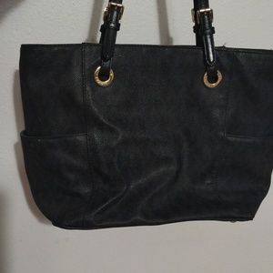 Black MK bag with black MK marking around the bag